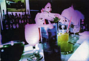 Photo of bartender pouring drinks, by Jonathan Kochan.